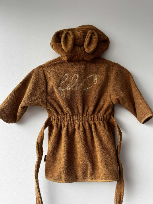 Gepersonaliseerde kinderbadjas met geborduurde naam.